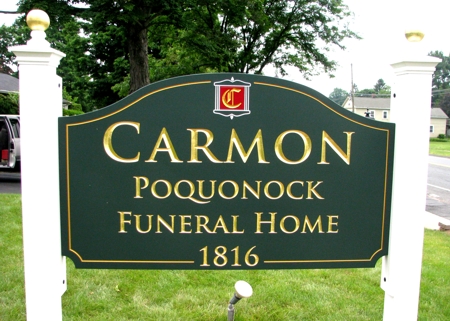 Custom business sign for a local funeral home. Lettering is in gold leaf.